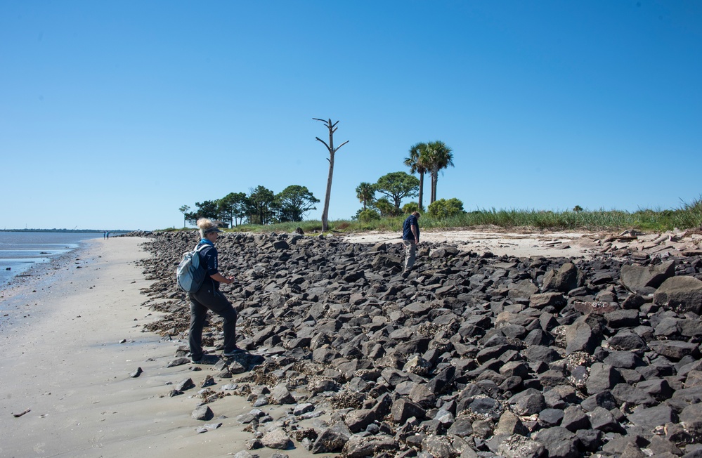 A shoreline assessment team surveys rip rap