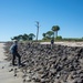 A shoreline assessment team surveys rip rap
