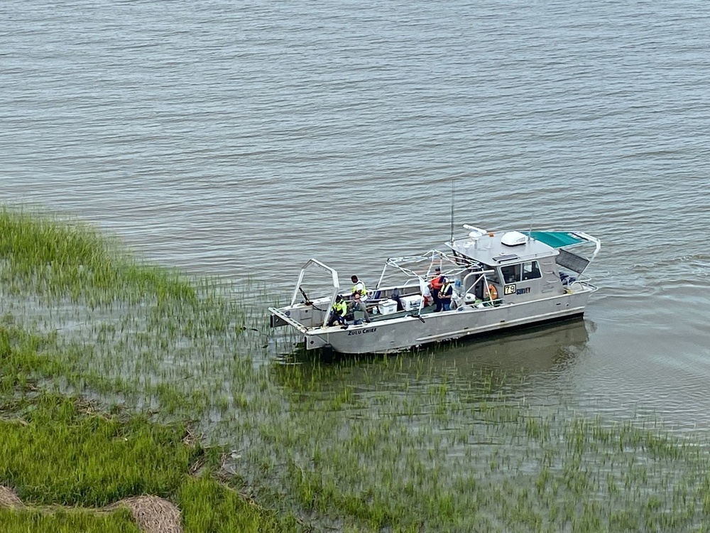 A response vessel crew recovers a piece of debris
