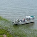 A response vessel crew recovers a piece of debris