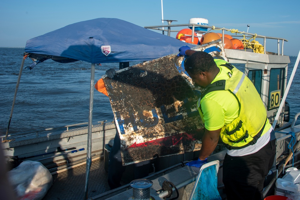 A responder recovers a piece of debris