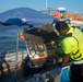 A responder recovers a piece of debris