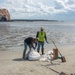 A shoreline clean up team recovers freshly deposited oil