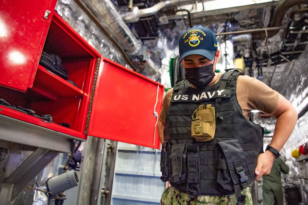 USS Charleston Sailor Prepares for OOD Watch