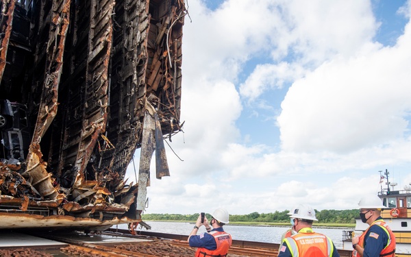 Personnel inspect Section Six of the Golden Ray