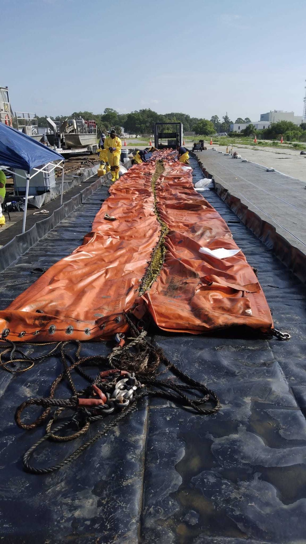 Technicians inspect and clean a Current Buster