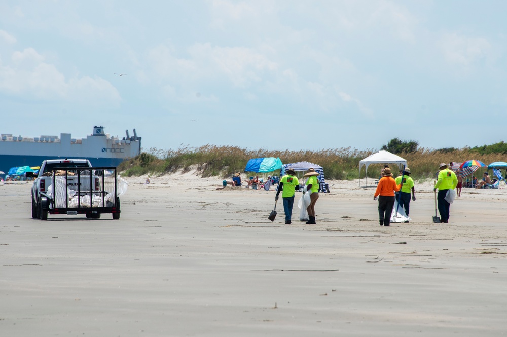A shoreline clean-up team removes oil