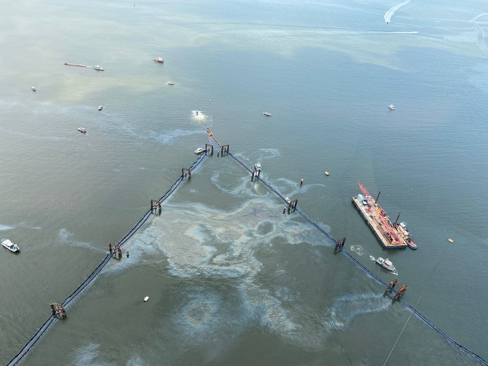 Multiple response vessels standby as a rainbow sheen approaches