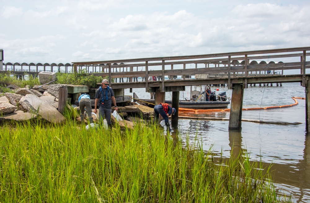 A shoreline clean-up team recovers oil