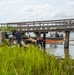 A shoreline clean-up team recovers oil