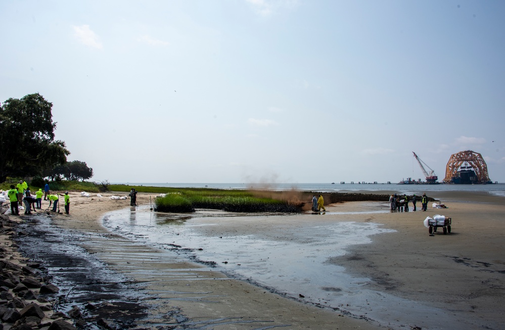 Multiple shoreline clean-up teams deploy treatments