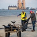 A shoreline clean-up team removes oil