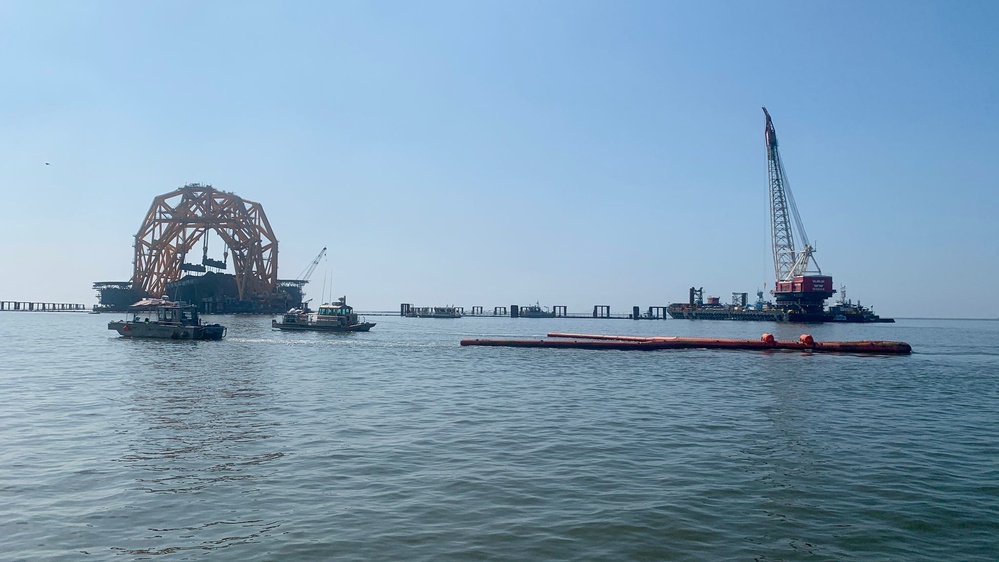 On-water response teams tow a Current Buster