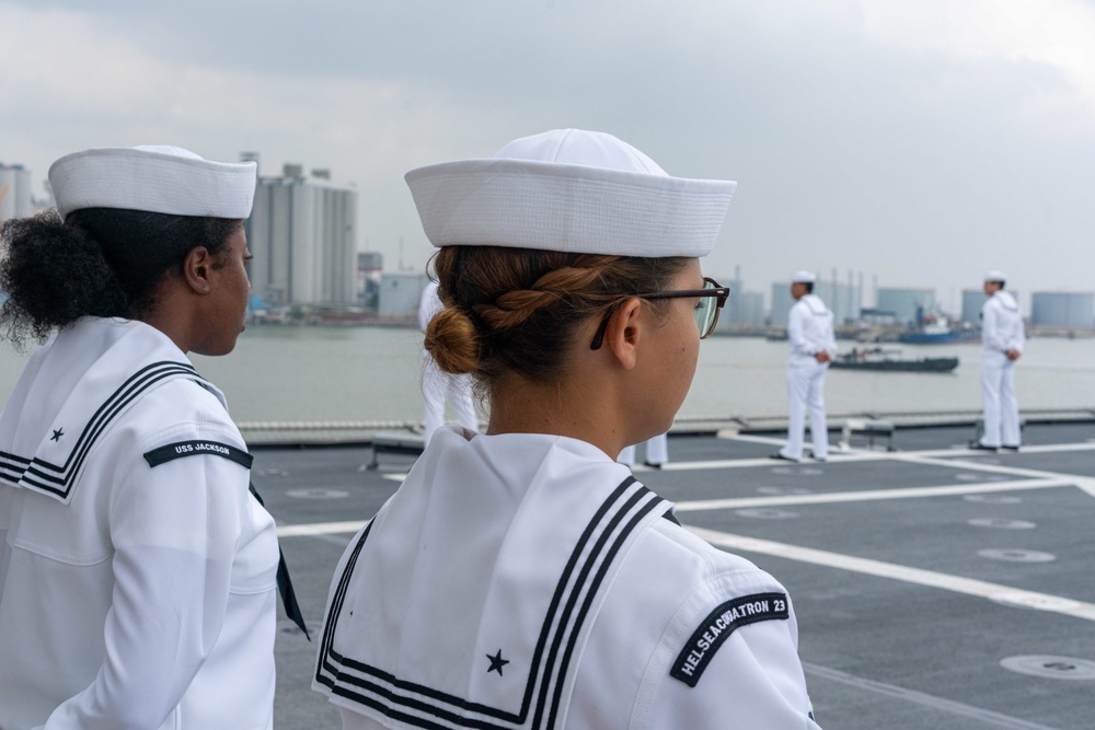 USS Jackson (LCS 6) and HSC 23 Sailors Conduct Colors Detail