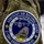 Kentucky Air Guard enters new era with arrival of C-130J Super Hercules aircraft A close-up photograph of an embroidered military patch sewn onto an olive drab/multicam military uniform sleeve. The patch belongs to the Kentucky Air National Guard, specifically the 123rd Airlift Wing, and commemorates the C-130J Super Hercules aircraft. The patch features detailed embroidery including an aircraft, tail section markings, state outline, and unit motto.