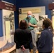Museum volunteer leads guided tour