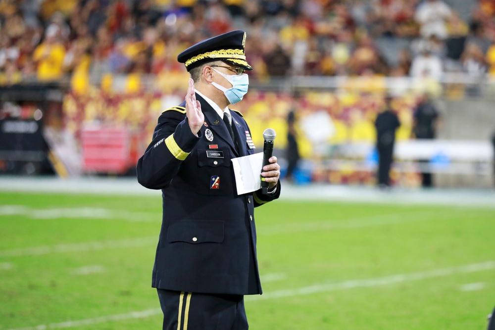 Brig. Gen. Christopher Sandison, Deputy Adjutant General, Arizona National Guard administers the Oath of Enlistment during ASU Salute to Service Game.