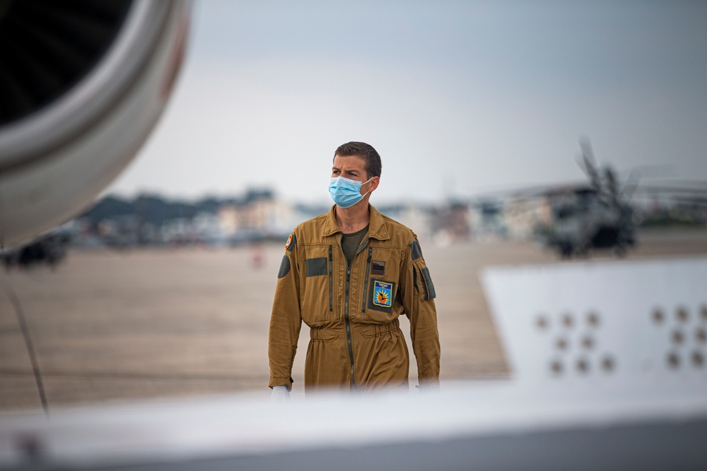 UN Command-Rear representatives and members of the French Navy observe takeoff and landing of the Falcon F200