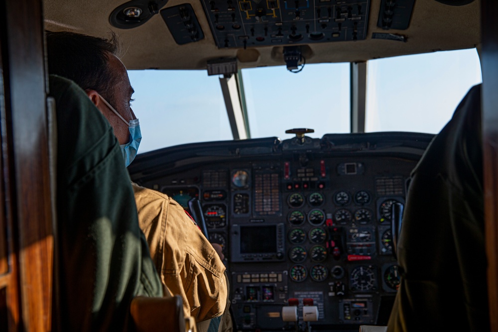 UN Command-Rear representatives and members of the French Navy observe takeoff and landing of the Falcon F200