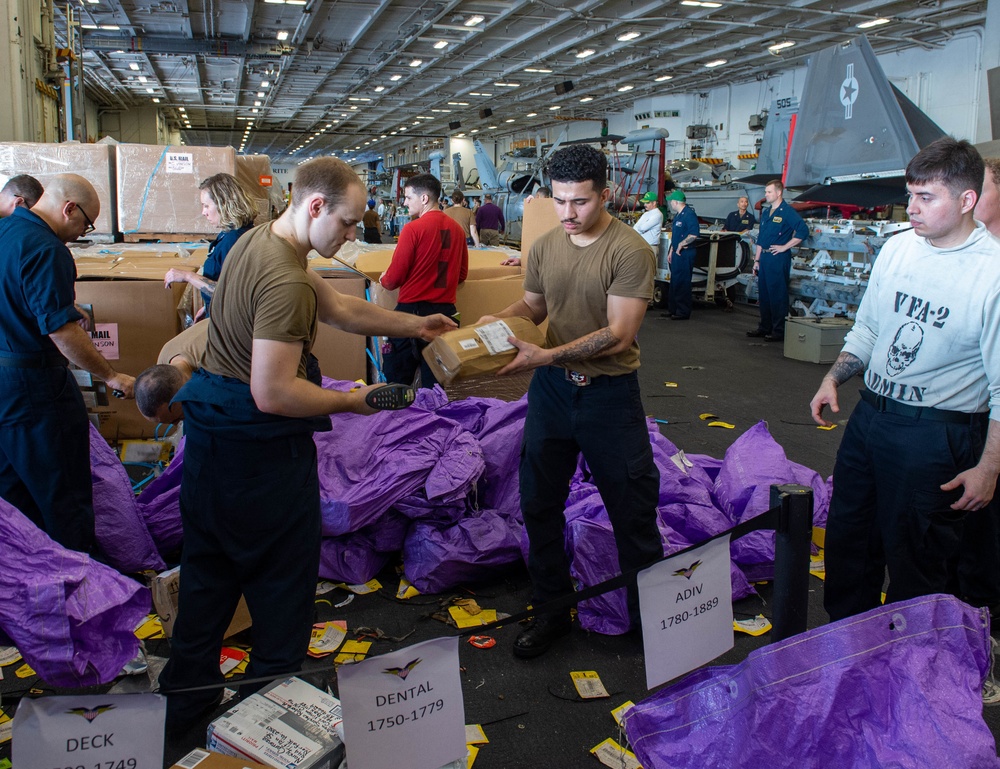 USS Carl Vinson (CVN 70) Sailors Distribute Mail