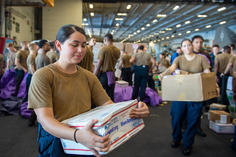 USS Carl Vinson (CVN 70) Sailors Distribute Mail