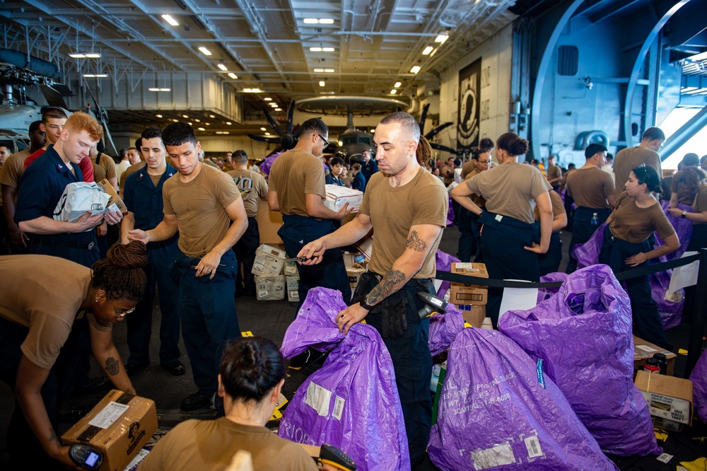 USS Carl Vinson (CVN 70) Sailors Distribute Mail