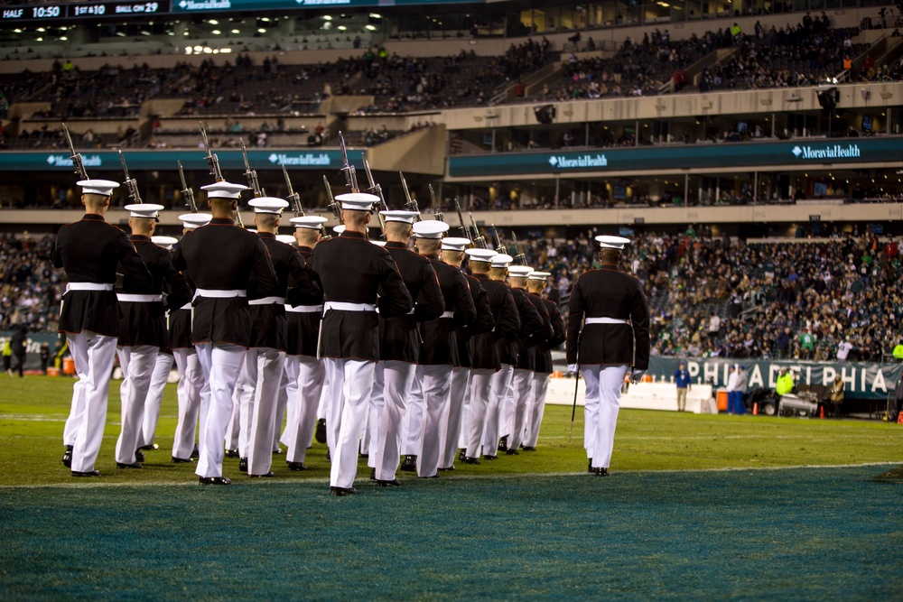 Marines with the Silent Drill Platoon perform during a halftime show at Lincoln Financial Field in Philadelphia