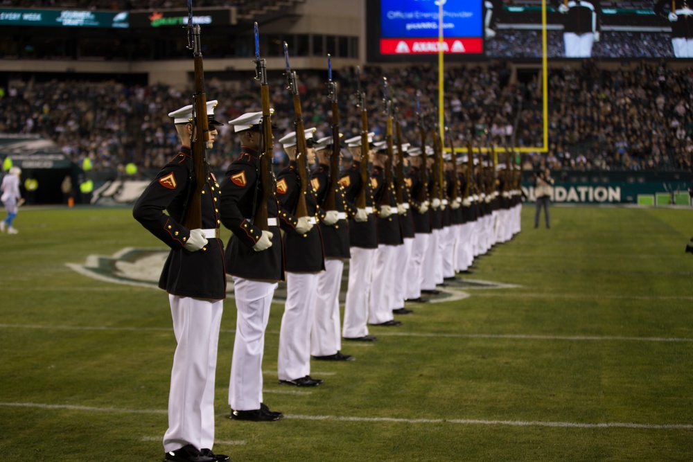 Marines with the Silent Drill Platoon perform during a halftime show at Lincoln Financial Field in Philadelphia