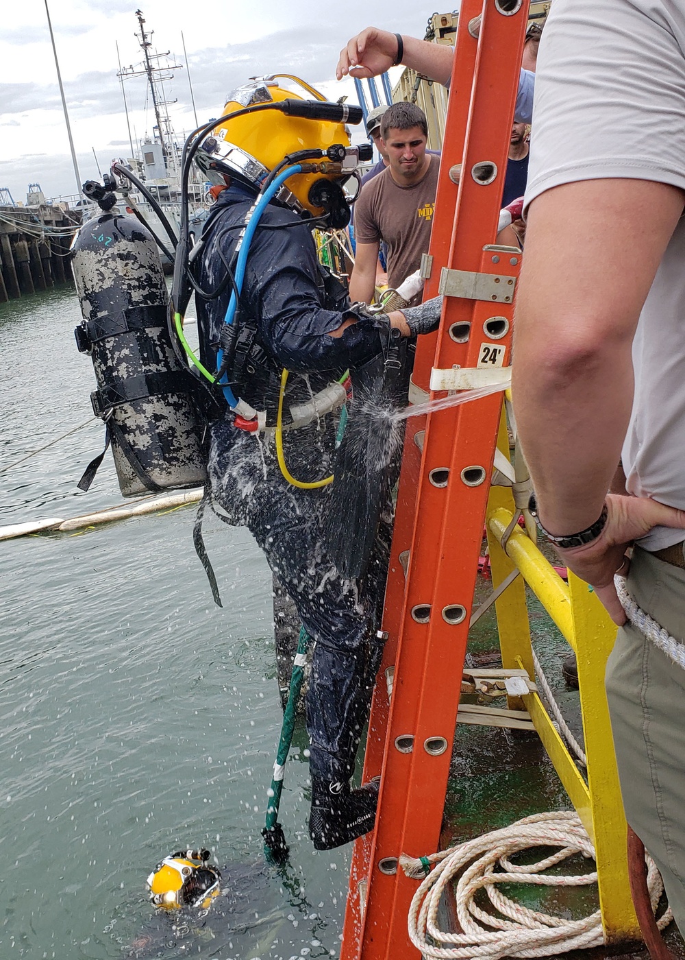 MDSU-2 Navy Diver is Hosed Off After Completing a Dive