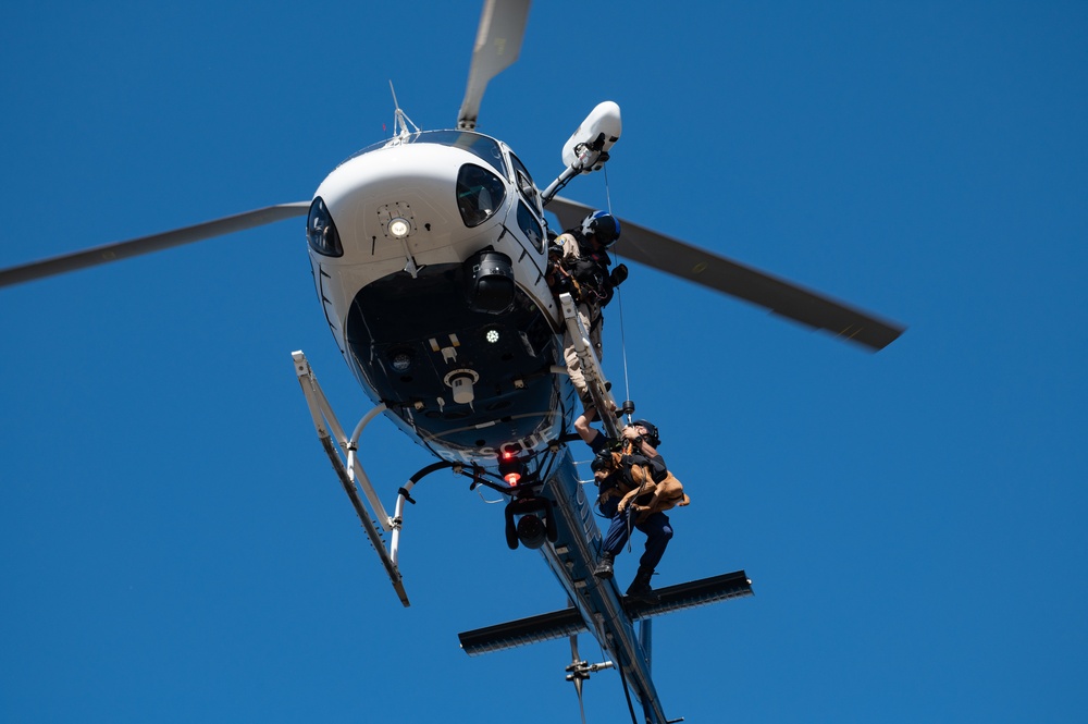 Coast Guard member conducts K9 hoist training