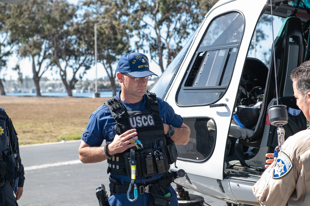 Coast Guard member prepares for K9 hoist training