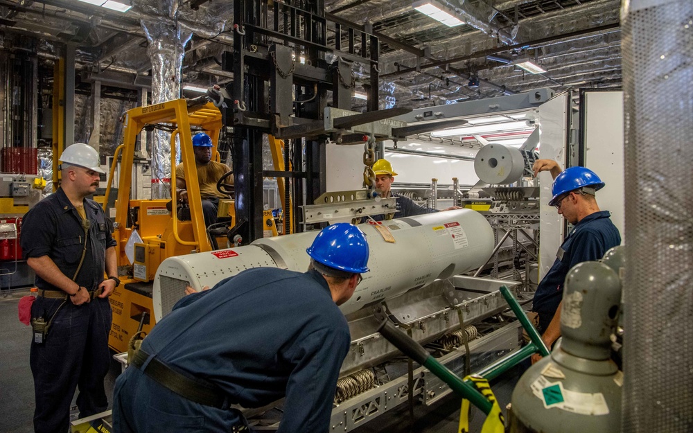 USS Charleston Sailors Transport Airbourne Laser Mine Detection System
