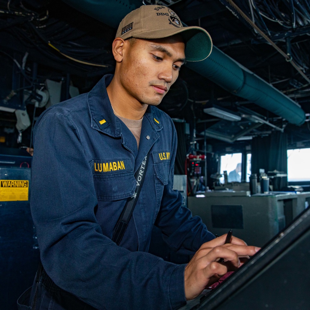 ENS Reuben Lumaban Mans the Bridge Radar Console aboard the USS Dewey