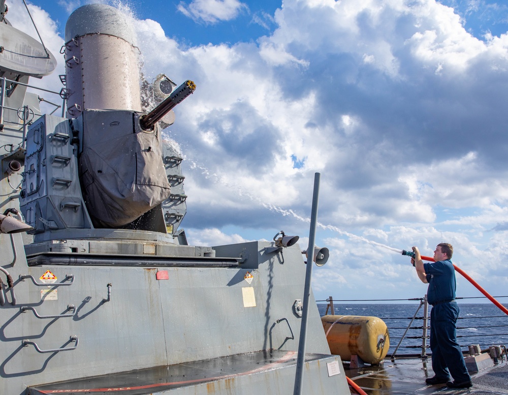 FC2 Caleb Platte Conducts a Fresh Water Wash-down on the USS Dewey