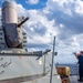 FC2 Caleb Platte Conducts a Fresh Water Wash-down on the USS Dewey