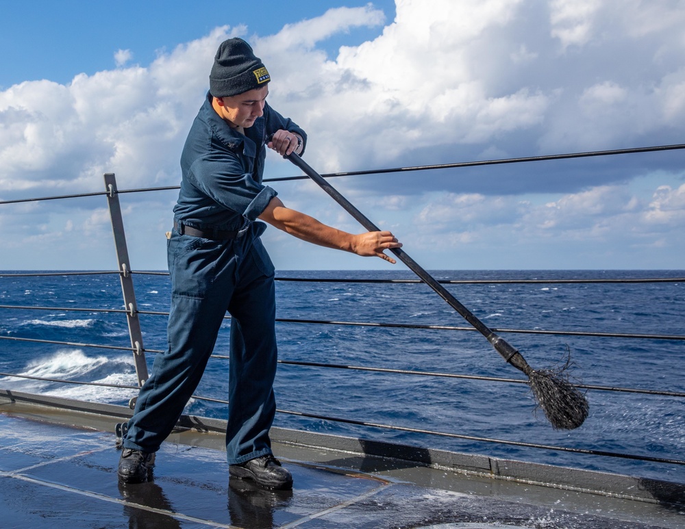 STG3 Bryan Leyva Conducts a Fresh Water Wash-down aboard the USS Dewey