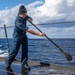 STG3 Bryan Leyva Conducts a Fresh Water Wash-down aboard the USS Dewey