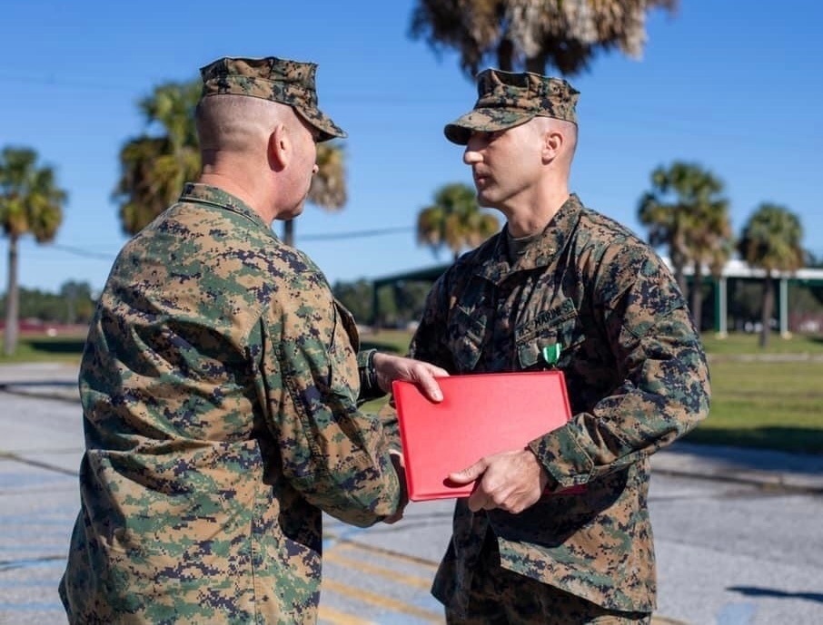 Commanding Officer awards Marine for performance at 6th Marine Corps District