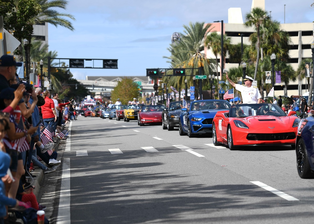 Commander, U.S. Naval Forces Southern Command/U.S. 4th Fleet Waves to the Crowd at Veterans Day Parade