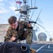 U.S. Marine aboard USS Charleston OP Tests Equipment