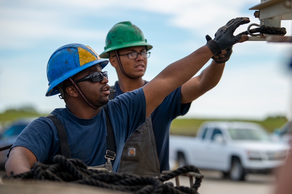 The crew aboard Coast Guard Cutter Pamlico performs a deck evolution