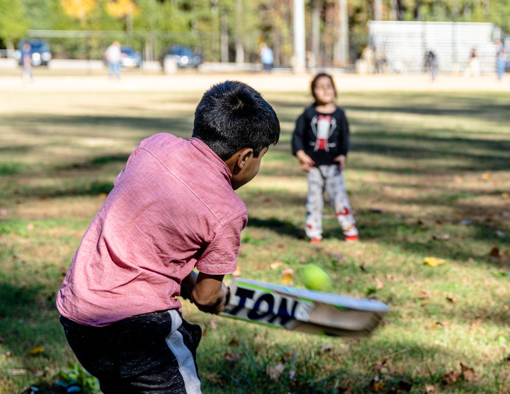 Afghan Evacuees with TF Eagle play Cricket Game at Fort Lee
