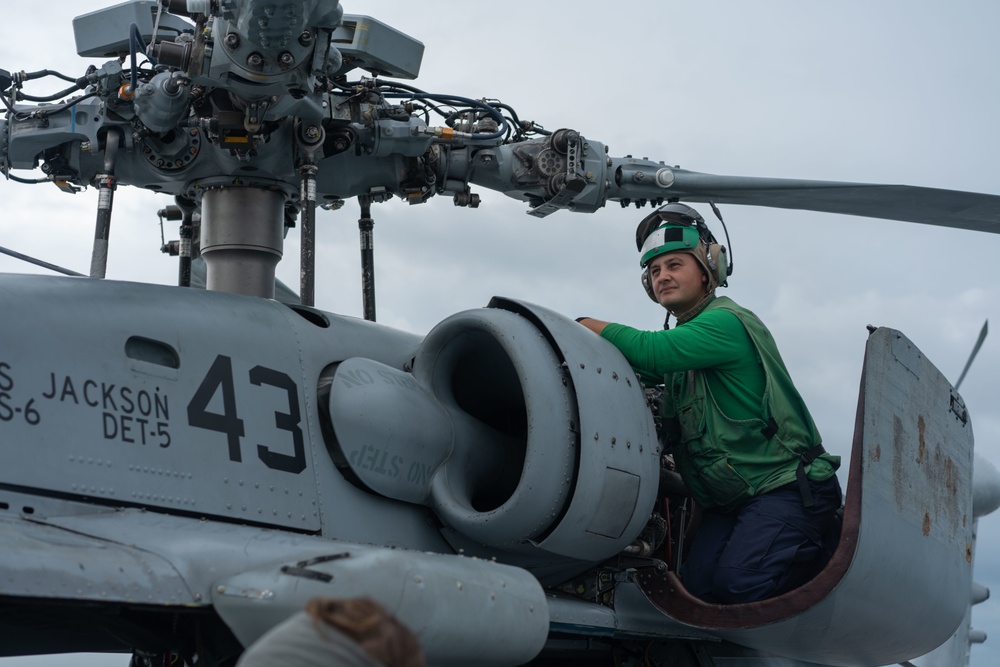 HSC 23 Sailors Conduct Maintains Helicopter