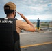 USS Sioux City Sailor Renders a Salute While Standing Watch