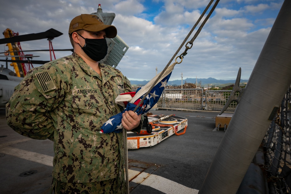 USS Sioux City Sailor Stands by to Hoist the Ensign