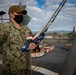 USS Sioux City Sailor Stands by to Hoist the Ensign