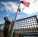 USS Sioux City Sailor Hoists the Ensign During Morning Colors