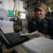 USS Sioux City Sailor Inputs Tag Outs into the Computer