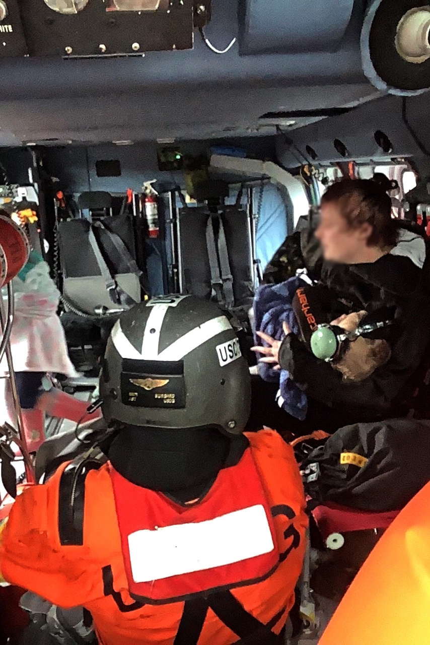 Coast Guard helicopter crews assist in evacuation of residents near Forks, WA