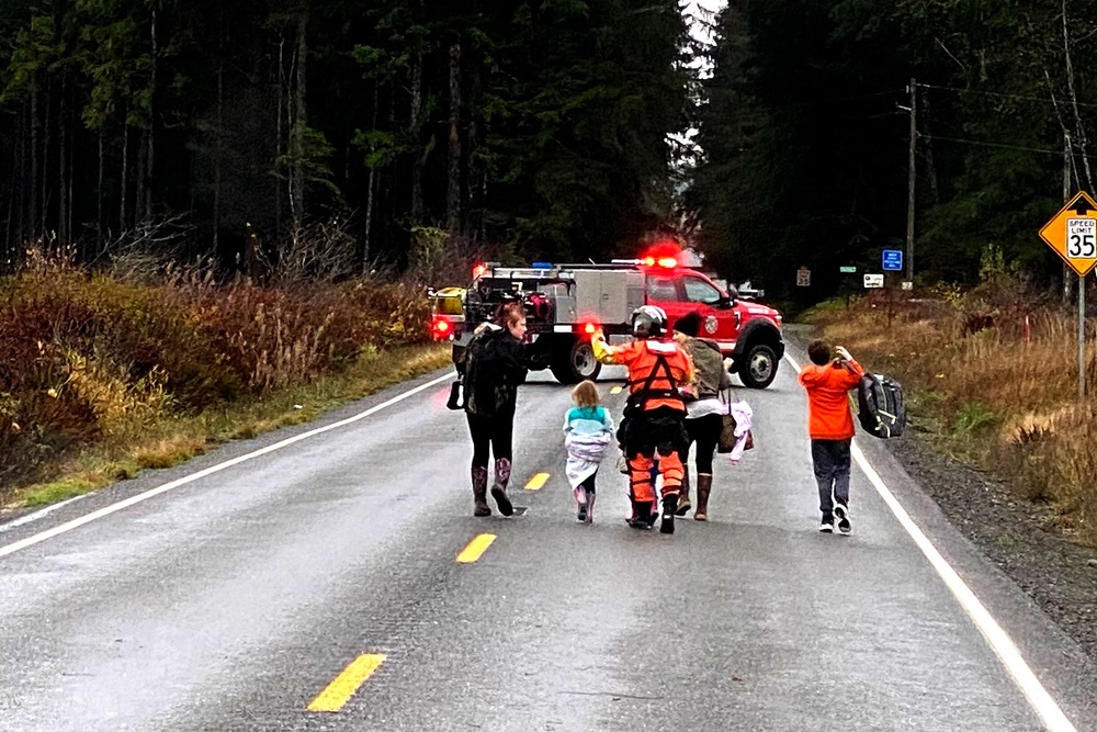 Coast Guard helicopter crews assist in evacuation of residents near Forks, WA